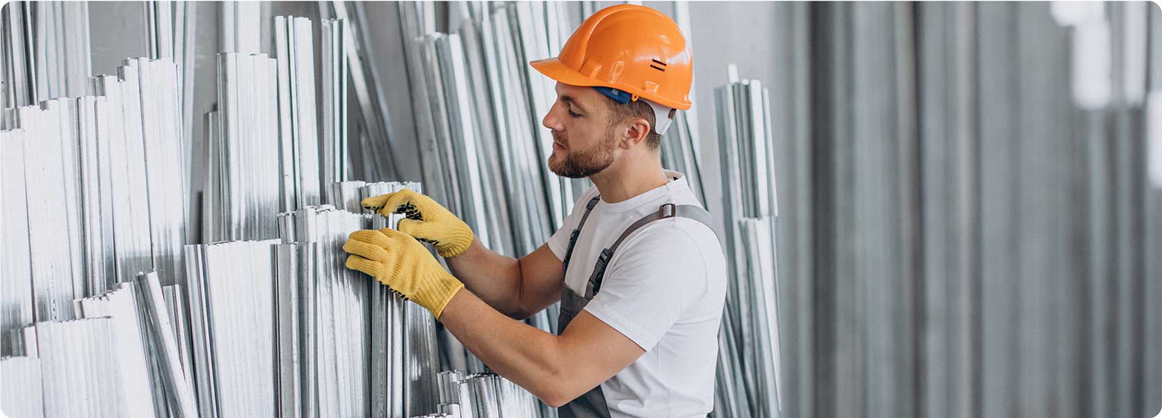 worker selecting a steel material