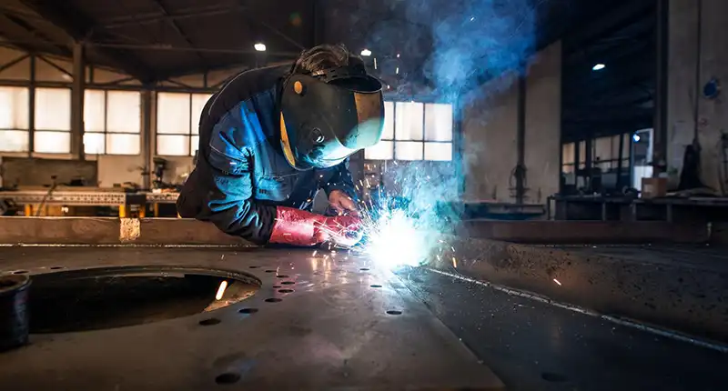 Precision-cut steel components in fabrication workshop