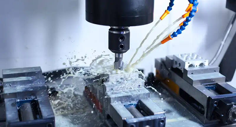 CNC lathe spinning a cylindrical metal shaft with high precision.