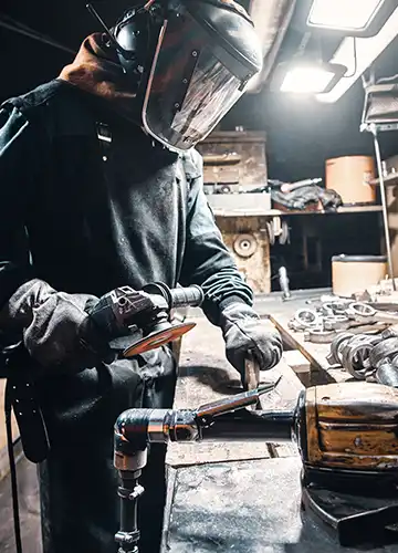 Diagram illustrating common welding hazards: fumes, arc flash, and electrical shock.