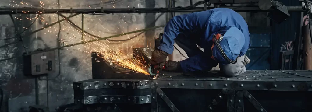 Skilled fabricator working on structural steel in Dubai plant