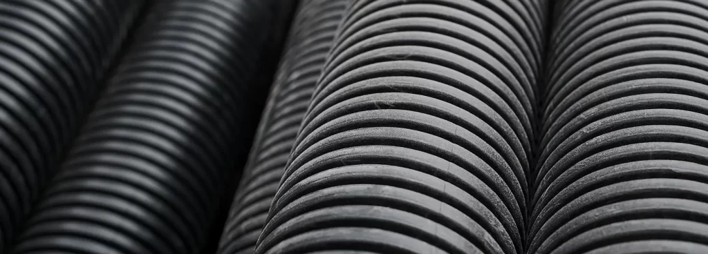 Expert team performing custom hydraulic pipe bending Dubai for structural steel fabrication project