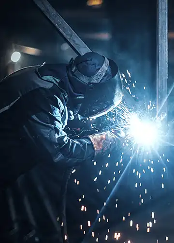 Steel components undergoing weld testing and dye penetrant inspection in ISO 9001 certified UAE fabrication facility